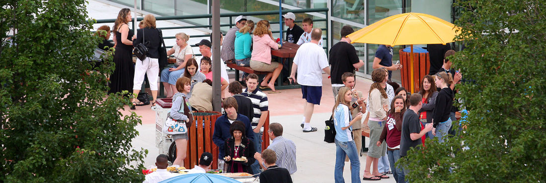 Students gathering outside in the summer