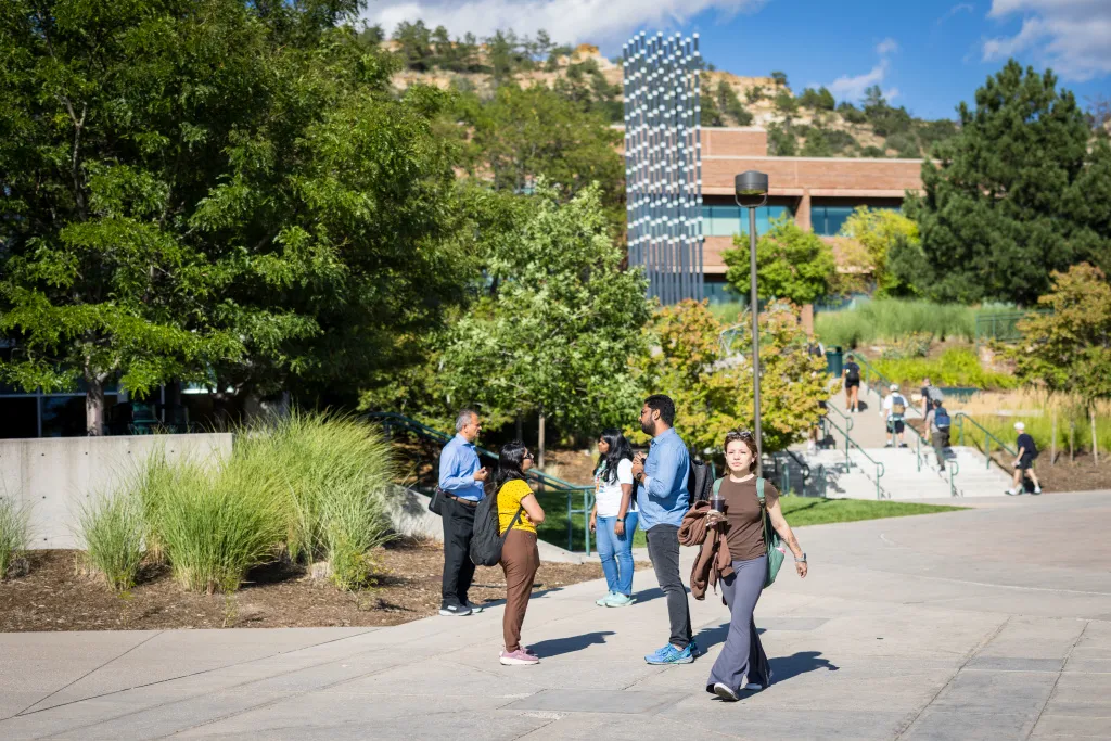 faculty and students walking on campus